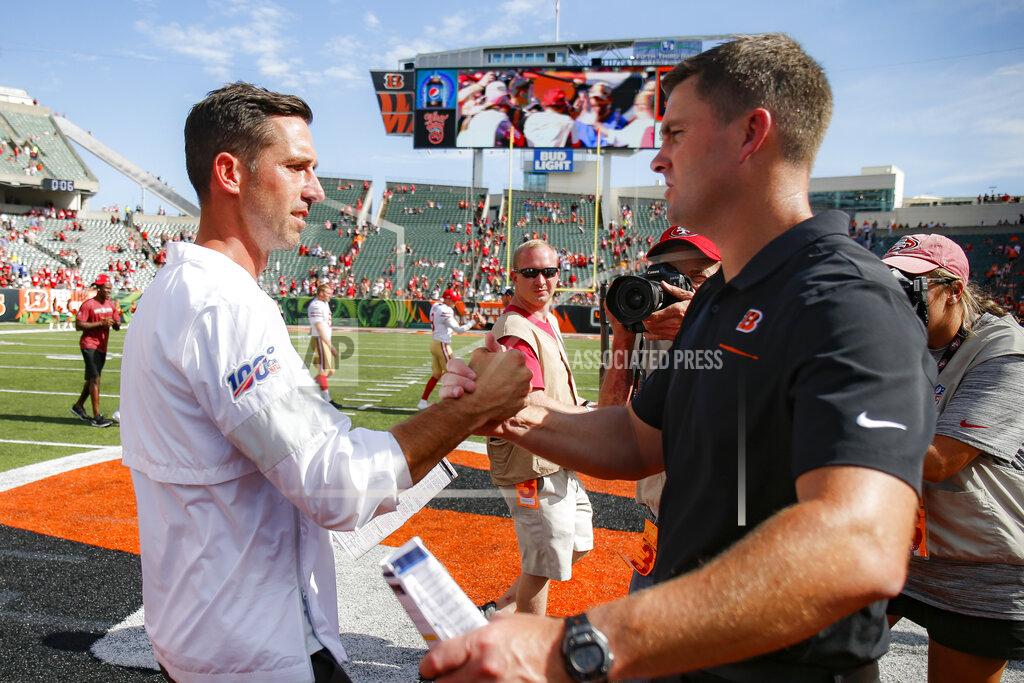Gary Landers San Francisco 49ers head coach Kyle Shanahan, left, meets with Cincinnati Bengals head coach Zac Taylor, right, after an NFL football game, Sunday, Sept. 15, 2019, in Cincinnati. The 49ers won 41-17. (AP Photo/Gary Landers)