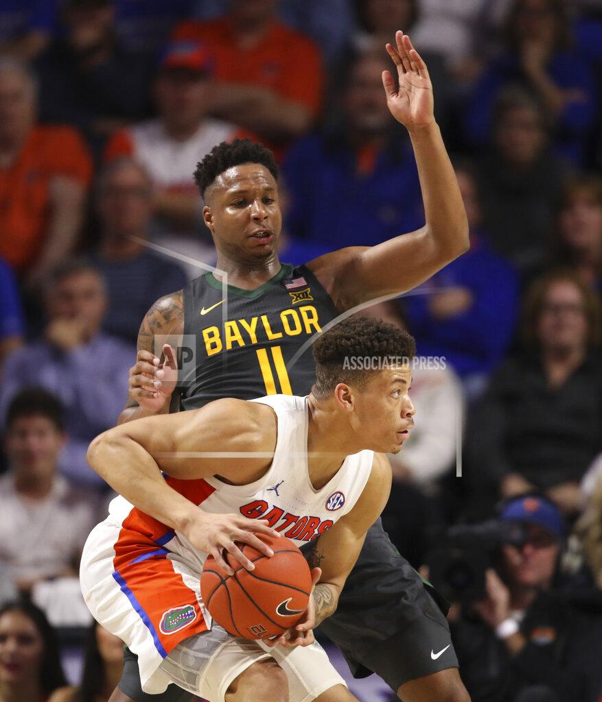 Matt Stamey Baylor guard Mark Vital, top, defends against Florida forward Keyontae Johnson, bottom, during the second half of an NCAA college basketball game Saturday, Jan. 25, 2020, in Gainesville, Fla. (AP Photo/Matt Stamey)