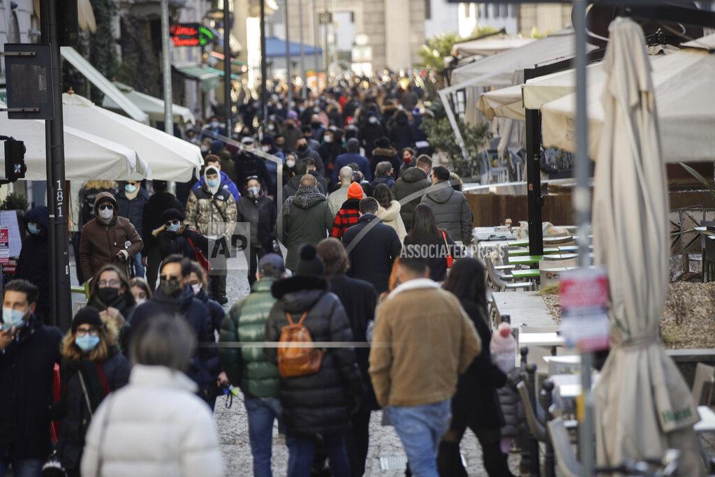 Luca Bruno People walk along Corso Como street in Milan, Italy, Sunday, Feb. 14, 2021. (AP Photo/Luca Bruno)
