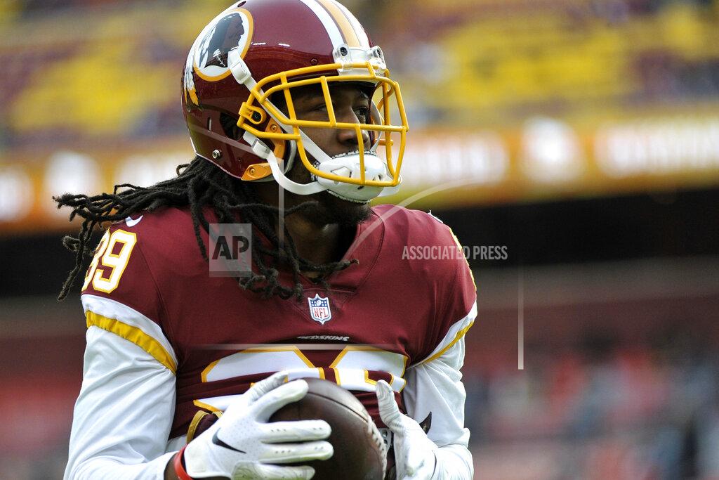 Mark Tenally File-This Dec. 30, 2018, file photo shows, Washington Redskins defensive back Adonis Alexander warming up prior to an NFL football game in Landover, Md. Alexander is expected to miss at least two weeks with a right quadriceps injury. Coach Jay Gruden confirmed the injury timeline Sunday, Aug. 4, 2019. Alexander has missed several practices in a row. (AP Photo/Mark Tenally, File)