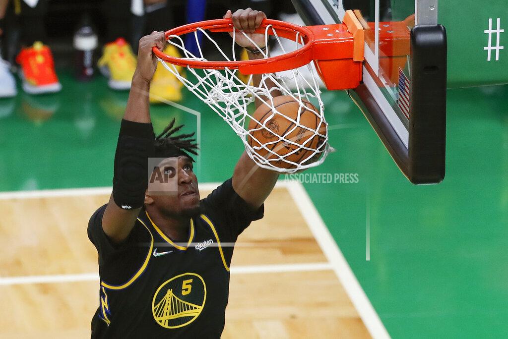 Michael Dwyer FILE - Golden State Warriors center Kevon Looney (5) dunks the ball against the Boston Celtics during the second quarter of Game 3 of basketball's NBA Finals, Wednesday, June 8, 2022, in Boston. The NBA's free agency period opens Thursday night, June 30, 2022, with teams and players finally free to negotiate new deals. (AP Photo/Michael Dwyer, File)