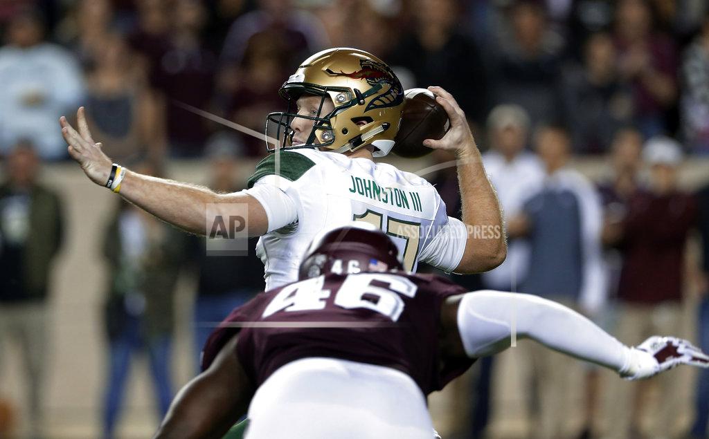 Michael Wyke UAB quarterback Tyler Johnston III (17) looks for a receiver as Texas A&M defensive lineman Landis Durham (46) closes in during the first half of an NCAA college football game Saturday, Nov. 17, 2018, in College Station, Texas. (AP Photo/Michael Wyke)