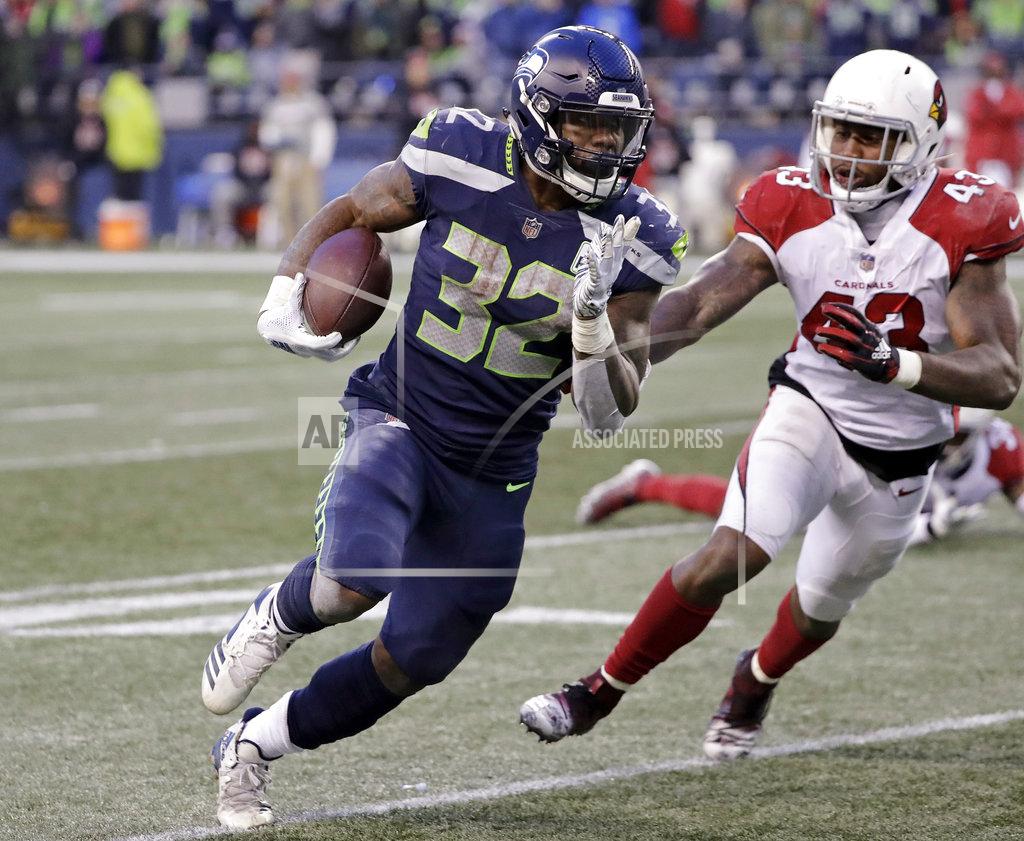 Ted S. Warren Seattle Seahawks' Chris Carson carries as Arizona Cardinals' Haason Reddick (43) pursues during the second half of an NFL football game, Sunday, Dec. 30, 2018, in Seattle. (AP Photo/Ted S. Warren)