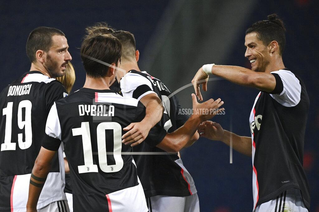 Massimo Paolone Juventus' Paulo Dybala, no. 10, celebrates scoring with teammate Cristiano Ronaldo, right, and teammates during the Serie A soccer match between Bologna FC and Juventus FC at Stadio Renato Dall'Ara stadium in Bologna, Monday June 22, 2020. (Massimo Paolone/LaPresse via AP)