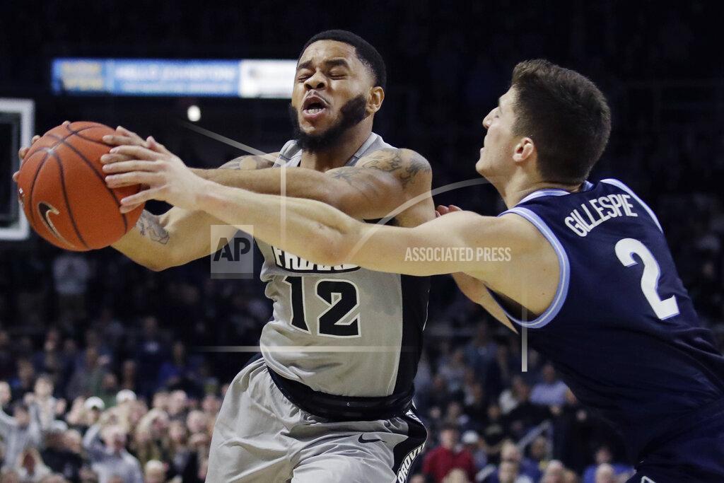 Elise Amendola Providence guard Luwane Pipkins (12) secures a loose ball against Villanova guard Collin Gillespie (2) in the second half of an NCAA college basketball game, Saturday, Jan. 25, 2020, in Providence, R.I. Villanova won, 64-60. (AP Photo/Elise Amendola)