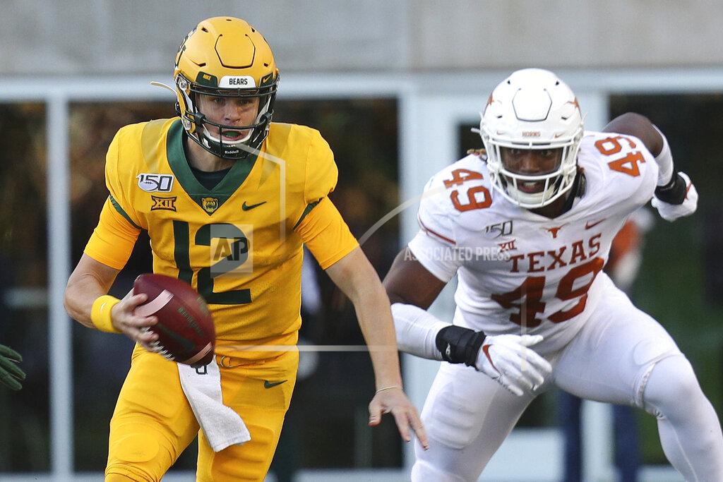 Richard W. Rodriguez Baylor quarterback Charlie Brewer (12) runs the ball against Texas in the third quarter in an NCAA college football game Saturday, Nov. 23, 2019, in Waco, Texas. (AP Photo/Richard W. Rodriguez)