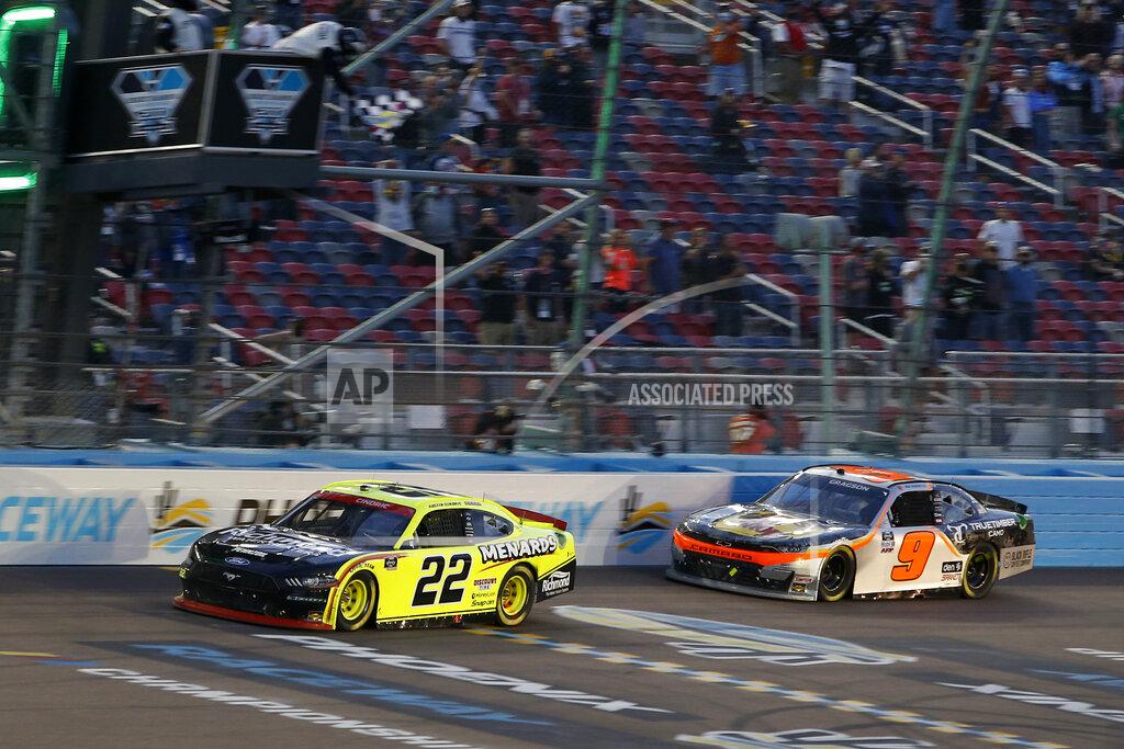 Ralph Freso Austin Cindric (22) crosses the finish line ahead of Noah Gragson (9) to win a NASCAR Xfinity Series auto race and the season championship at Phoenix Raceway, Saturday, Nov. 7, 2020, in Avondale, Ariz. (AP Photo/Ralph Freso)