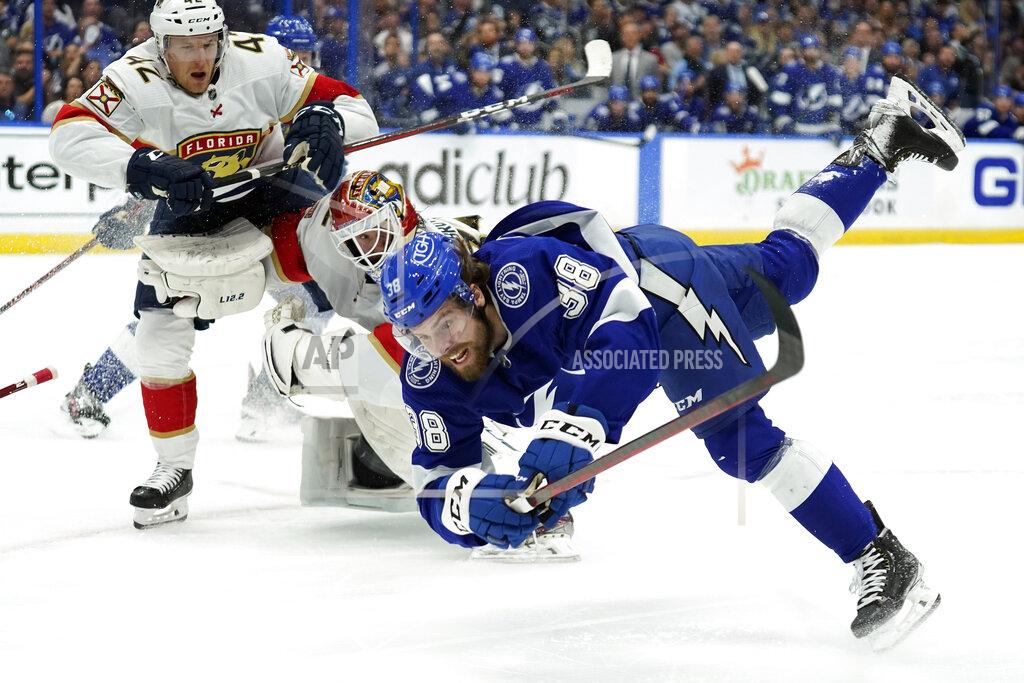 Chris O'MEara Tampa Bay Lightning left wing Brandon Hagel (38) goes down after crashing into Florida Panthers goaltender Sergei Bobrovsky (72) and defenseman Gustav Forsling (42) during the second period in Game 3 of an NHL hockey second-round playoff series Sunday, May 22, 2022, in Tampa, Fla. (AP Photo/Chris O'Meara)