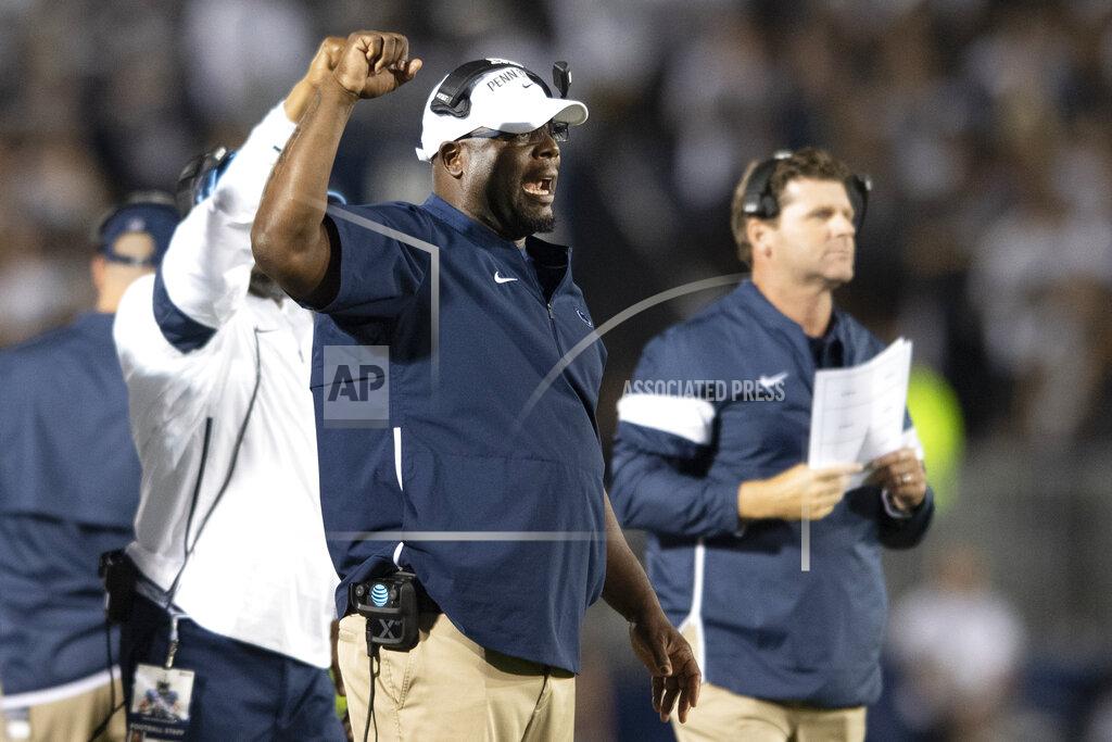 FILE - In this Sept. 7, 2019, file photo, then-Penn State defensive line coach Sean Spencer talks with his players in the second quarter of an NCAA college football game against Buffalo in State College, Pa. After spending more than two decades in the college ranks as an assistant coach, Sean Spencer is bringing his high-energy approach to the New York Giants. Spencer has a big personality and the Giants defensive linemen are learning it first hand. (AP Photo/Barry Reeger, File)