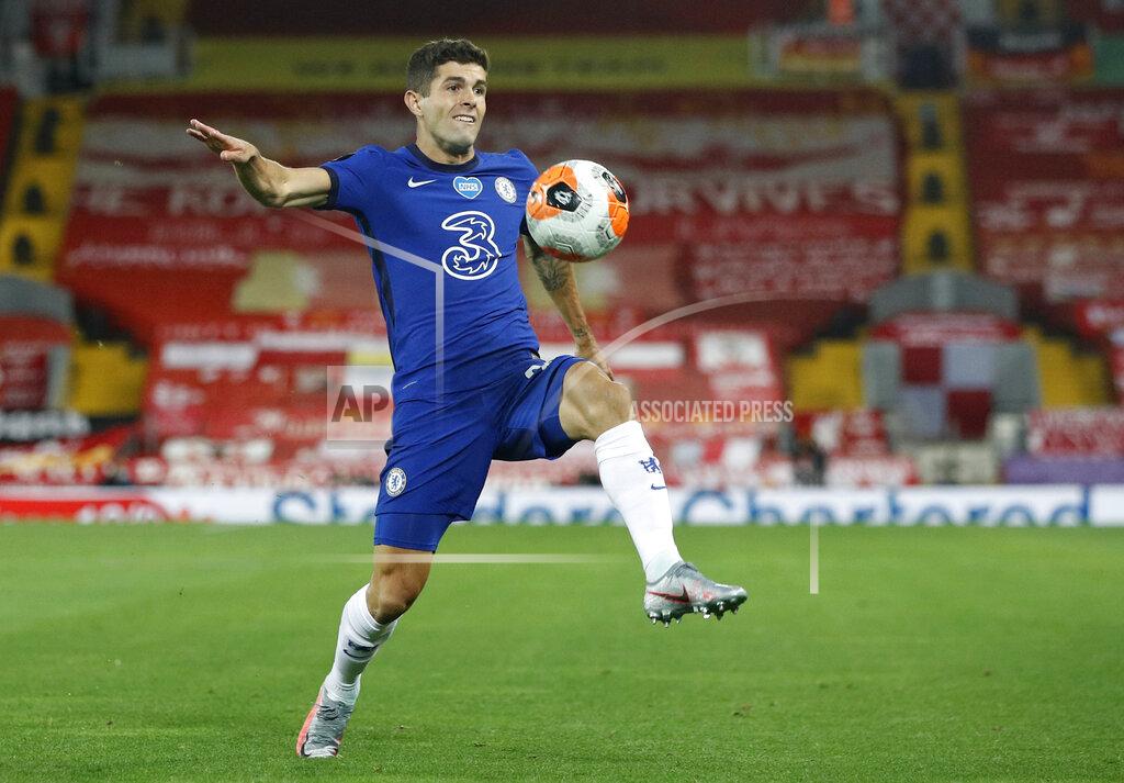 Phil Noble FILE - In this Wednesday, July 22, 2020 file photo, Chelsea's Christian Pulisic controls the ball during the English Premier League soccer match between Liverpool and Chelsea at Anfield Stadium in Liverpool, England. Frank Lampard’s squad has certainly seen the most intriguing changes ahead of the new campaign - having been banned from signing players last summer, they have looked to make up for lost time and recruited some big names to replace long-term servants such as Pedro and Willian. (Phil Noble/Pool via AP, file)