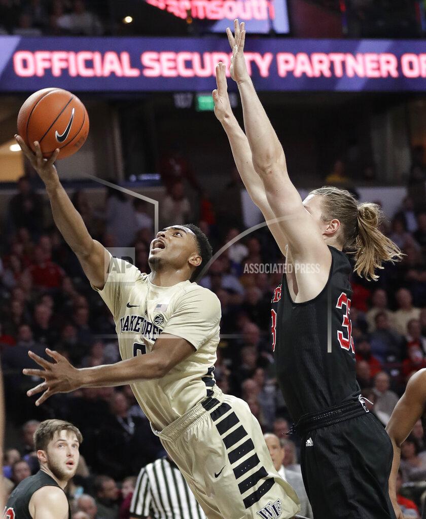 Chuck Burton Wake Forest's Brandon Childress (0) drive past North Carolina State's Wyatt Walker (33) during the first half of an NCAA college basketball game in Winston-Salem, N.C., Tuesday, Jan. 15, 2019. (AP Photo/Chuck Burton)