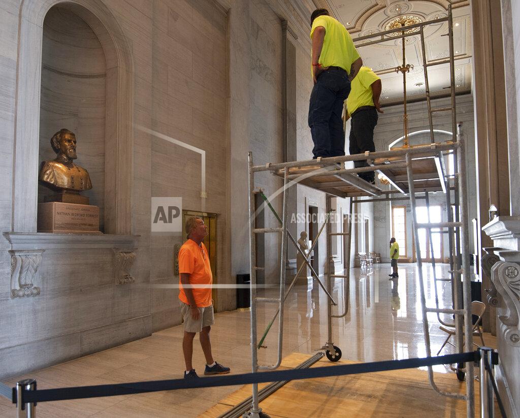 George Walker Iv Workers prepare scaffolding in front of a bust of Confederate general and early Ku Klux Klan leader Nathan Bedford Forrest at the State Capitol, Thursday, July 22, 2021, in Nashville, Tenn. A decades-long effort to remove the bust from the Tennessee Capitol cleared its final hurdle Thursday, with state leaders approving the final vote needed to allow the statue to be relocated to a museum. (George Walker IV/The Tennessean via AP)