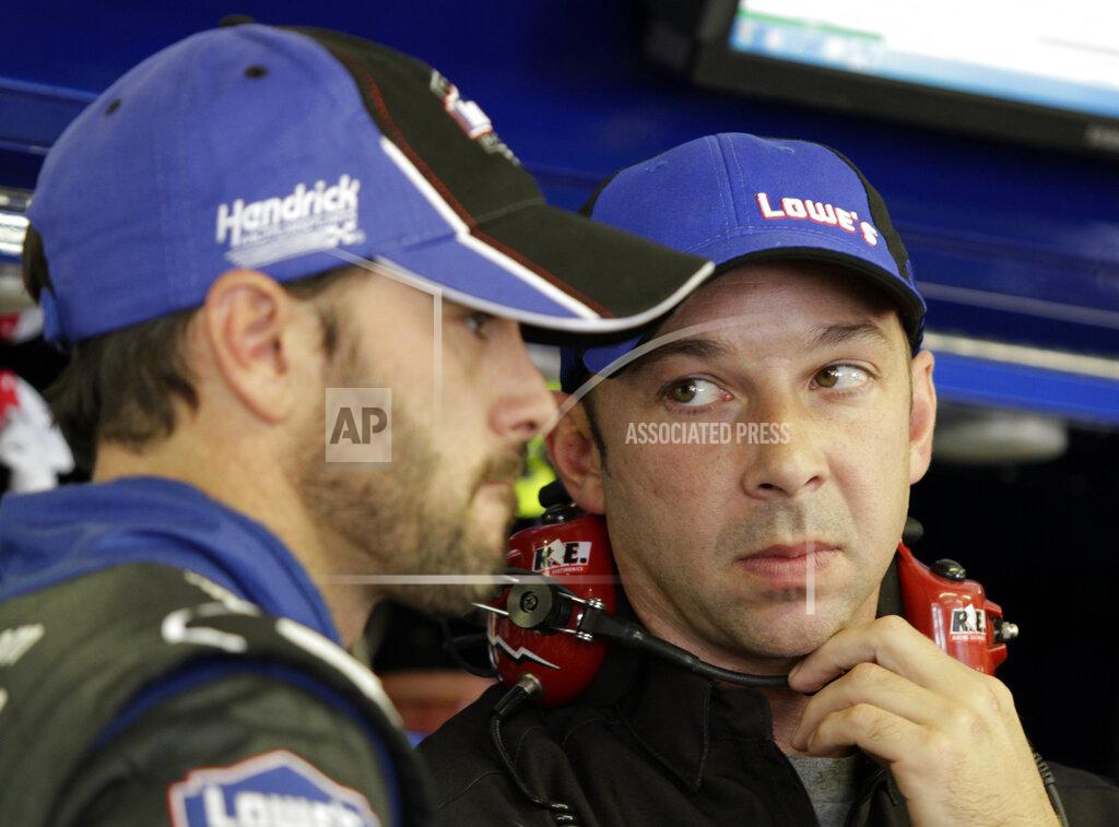 Mary Schwalm FILE - In this July 15, 2011, file photo, driver Jimmie Johnson, left, talks with crew chief Chad Knaus during practice for the NASCAR Lenox Industrial Tools 300 auto race at New Hampshire Motor Speedway in Loudon, N.H. Knaus is only five years older than Johnson and the two grew up in the Cup Series together.(AP Photo/Mary Schwalm, File)