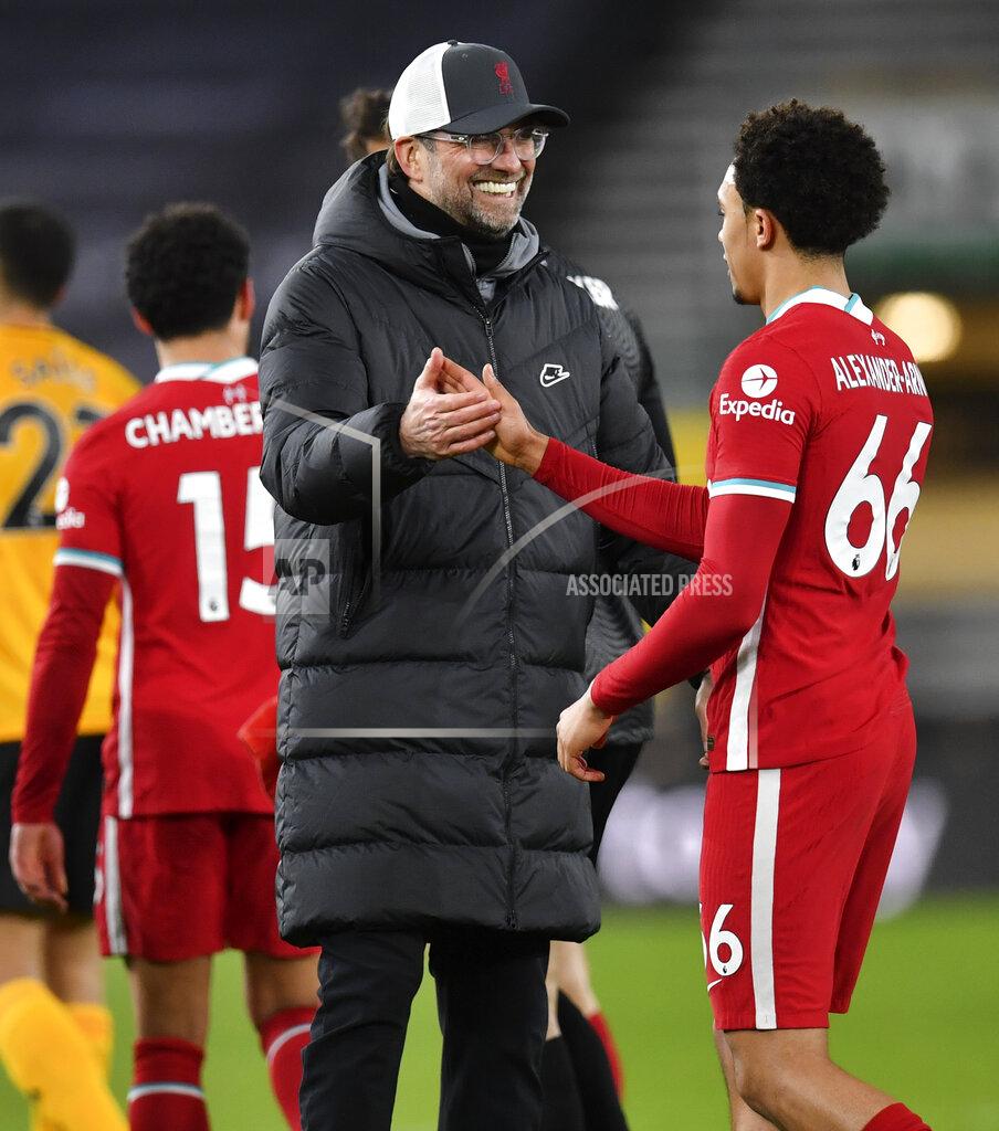 Paul Ellis Liverpool's manager Jurgen Klopp celebrates with Trent Alexander-Arnold following the English Premier League soccer match between Wolverhampton Wanderers and Liverpool at Molineux Stadium in Wolverhampton, England, Monday, March. 15, 2021. (AP Photo/Paul Ellis,Pool)