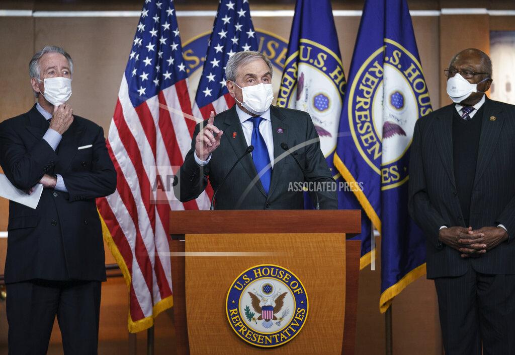J. Scott Applewhite House Budget Committee Chairman John Yarmuth, D-Ky., center, is flanked by Ways and Means Committee Chairman Richard Neal, D-Mass., left, and Majority Whip James Clyburn, D-S.C., at a news conference ahead of the vote on the Democrat's $1.9 trillion COVID-19 relief bill, at the Capitol in Washington, Tuesday, March 9, 2021. (AP Photo/J. Scott Applewhite)