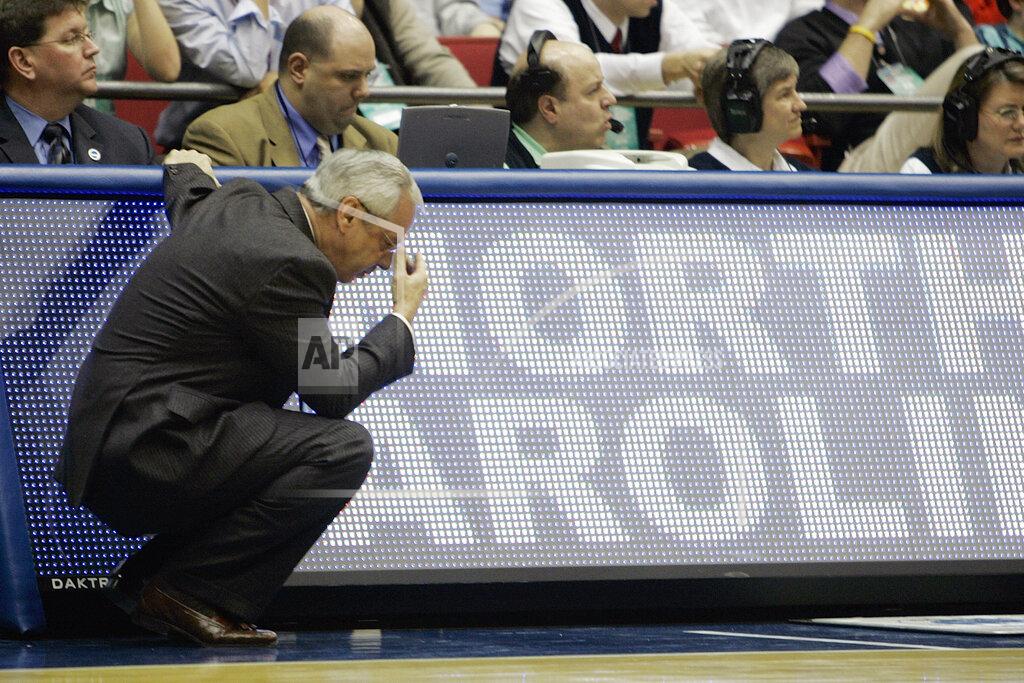 Ed Reinke FILE - In this March 19, 2006, file photo, North Carolina head coach Roy Williams looks down near the end of the NCAA second-round men's basketball game against George Mason in Dayton, Ohio. George Mason beat North Carolina, 65-60. (AP Photo/Ed Reinke, File)