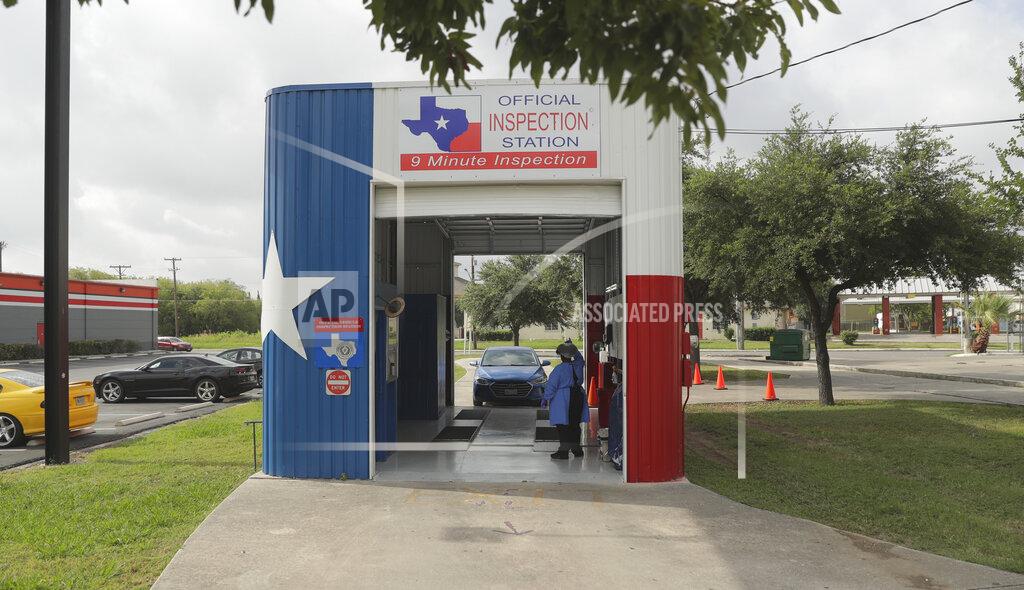 Eric Gay COVID-19 antibody testing and diagnostic testing are administered at a converted vehicle inspection station, Tuesday, July 7, 2020, in San Antonio. Local officials across Texas say their hospitals are becoming increasingly stretched and are in danger of becoming overrun as cases of the coronavirus surge. (AP Photo/Eric Gay)