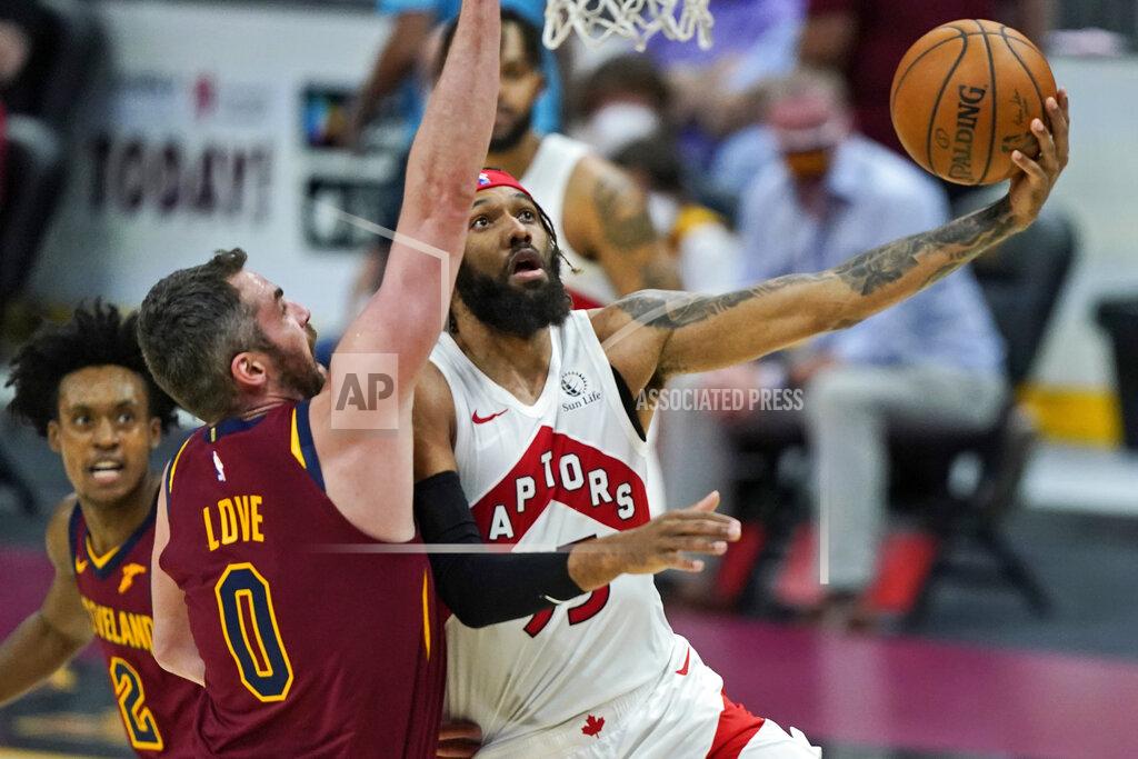 Tony Dejak Toronto Raptors' DeAndre' Bembry, right, drives to the basket against Cleveland Cavaliers' Kevin Love in the second half of an NBA basketball game, Saturday, April 10, 2021, in Cleveland. (AP Photo/Tony Dejak)