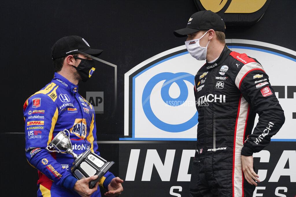 Darron Cummings Josef Newgarden, right, talks with Alexander Rossi following an IndyCar auto race at Indianapolis Motor Speedway, Friday, Oct. 2, 2020, in Indianapolis. Newgarden won the race, and Rossi finished second. (AP Photo/Darron Cummings)