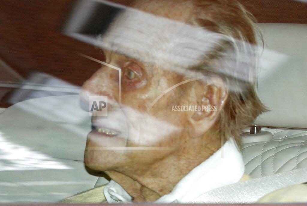 Alastair Grant Britain's Prince Philip leaves the King Edward VII hospital in the back of a car in London, Tuesday, March 16, 2021. The 99-year-old husband of Queen Elizabeth II has been hospitalized after a heart procedure. (AP Photo/Alastair Grant)