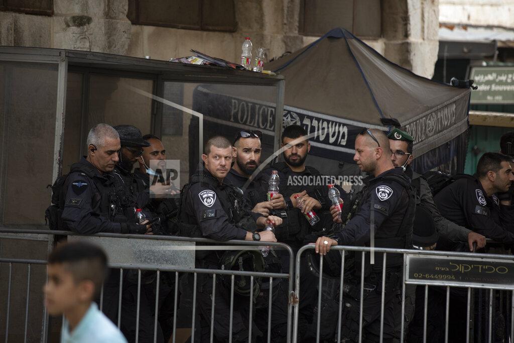 Maya Alleruzzo Israeli police stand guard at a checkpoint in the Old City of Jerusalem, Friday, Sept. 10, 2021. Amid increased Israeli-Palestinian tension over a recent prison break, Israeli police said an officer was lightly injured by a firearm in an attempt to thwart a suspected stabbing attack in the area. The Police, which arrested the suspect, did not immediately say how the officer was injured. (AP Photo/Maya Alleruzzo)