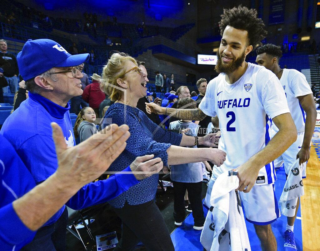 David Dermer FILE - In this Tuesday, Jan. 8, 2019, file photo, Buffalo guard Jeremy Harris (2) is congratulated by fans after the team defeated Toledo 110-80 in an NCAA college basketball game, in Amherst, N.Y. Buffalo is off to its best start in school history. (AP Photo/David Dermer, File)