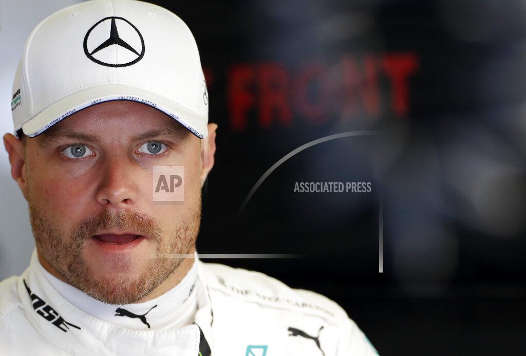 Laszlo Balogh FILE - In this file photo dated Saturday, Aug. 3, 2019, Mercedes driver Valtteri Bottas of Finland stands in the pit garage during the third practice session of the Hungarian Formula One Grand Prix at the Hungaroring racetrack in Mogyorod, northeast of Budapest, Hungary. The British-based Mercedes team announced Thursday Aug. 29, 2019, it has exercised the option to keep 30-year-old Finnish driver Bottas for the 2020 season, as teammate of world champion Lewis Hamilton. (AP Photo/Laszlo Balogh, FILE)