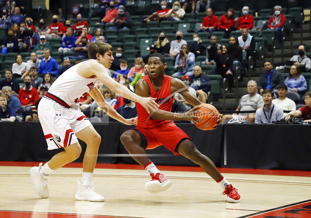 Jacob M. Langston Dayton Flyers guard Malachi Smith, right, drives against Dayton Flyers guard Lynn Greer III during the first half of an NCAA college basketball game Sunday, Nov. 28, 2021, in Lake Buena Vista, Fla. (AP Photo/Jacob M. Langston)