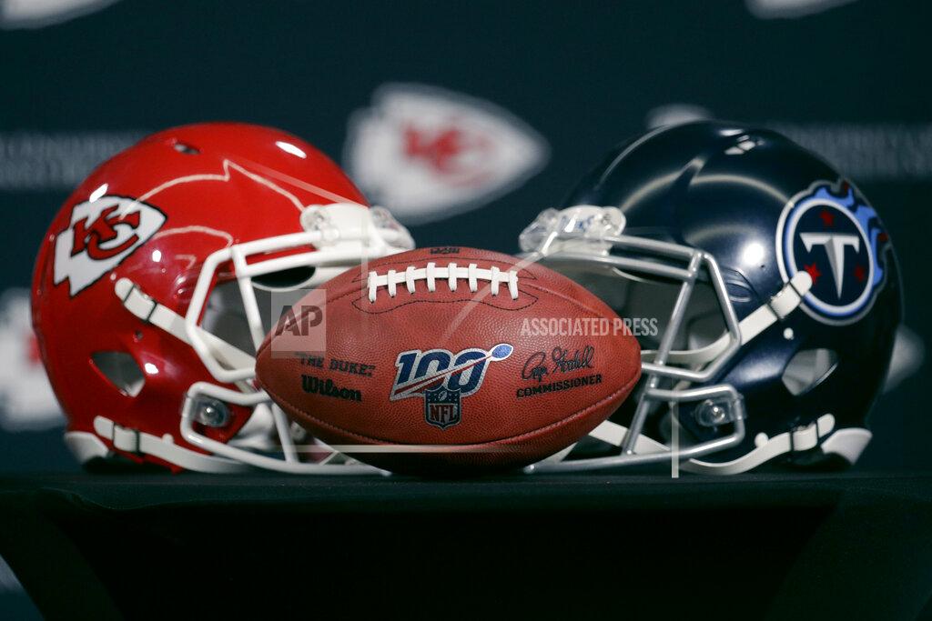 Charlie Riedel Helmets for the Kansas City Chiefs and the Tennessee Titans are displayed during a news conference for this weeks NFL conference championship football game at Arrowhead Stadium in Kansas City, Mo., Thursday, Jan. 16, 2020. (AP Photo/Charlie Riedel)