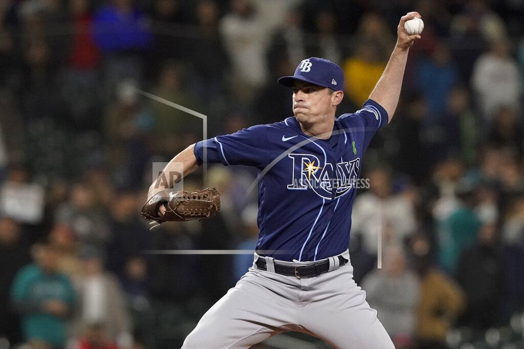 Ted S. Warren FILE - Tampa Bay Rays closing pitcher Brooks Raley throws to a Seattle Mariners batter during the ninth inning of a baseball game Thursday, May 5, 2022, in Seattle. The mass school shooting in Uvalde, Texas, was especially disturbing for Rays pitcher Brooks Raley. Uvalde is the 33-year-old left-hander’s hometown. (AP Photo/Ted S. Warren, File)