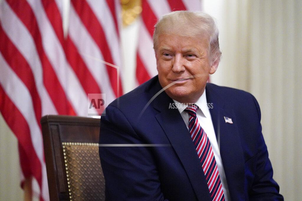 President Donald Trump listens during an event called "Kids First: Getting America's Children Safely Back to School" in the State Dining room of the White House, Wednesday, Aug. 12, 2020, in Washington. (AP Photo/Andrew Harnik)