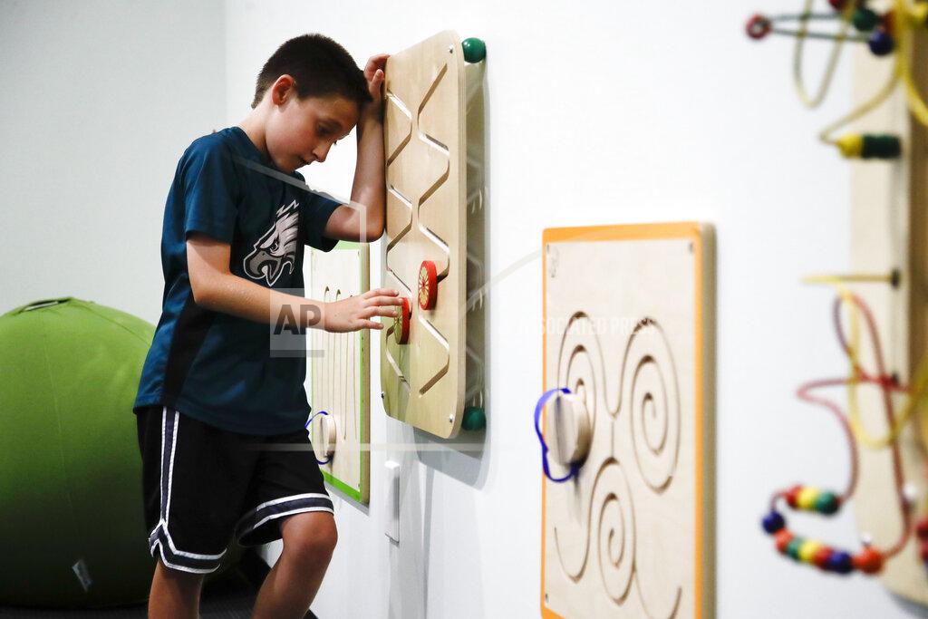 Matt Rourke In this Thursday, Aug. 22, 2019, photo, 10-year-old Jack Ykoruk plays in the Lincoln Financial Field sensory room before a preseason NFL football game between the Philadelphia Eagles and the Baltimore Ravens in Philadelphia. (AP Photo/Matt Rourke)