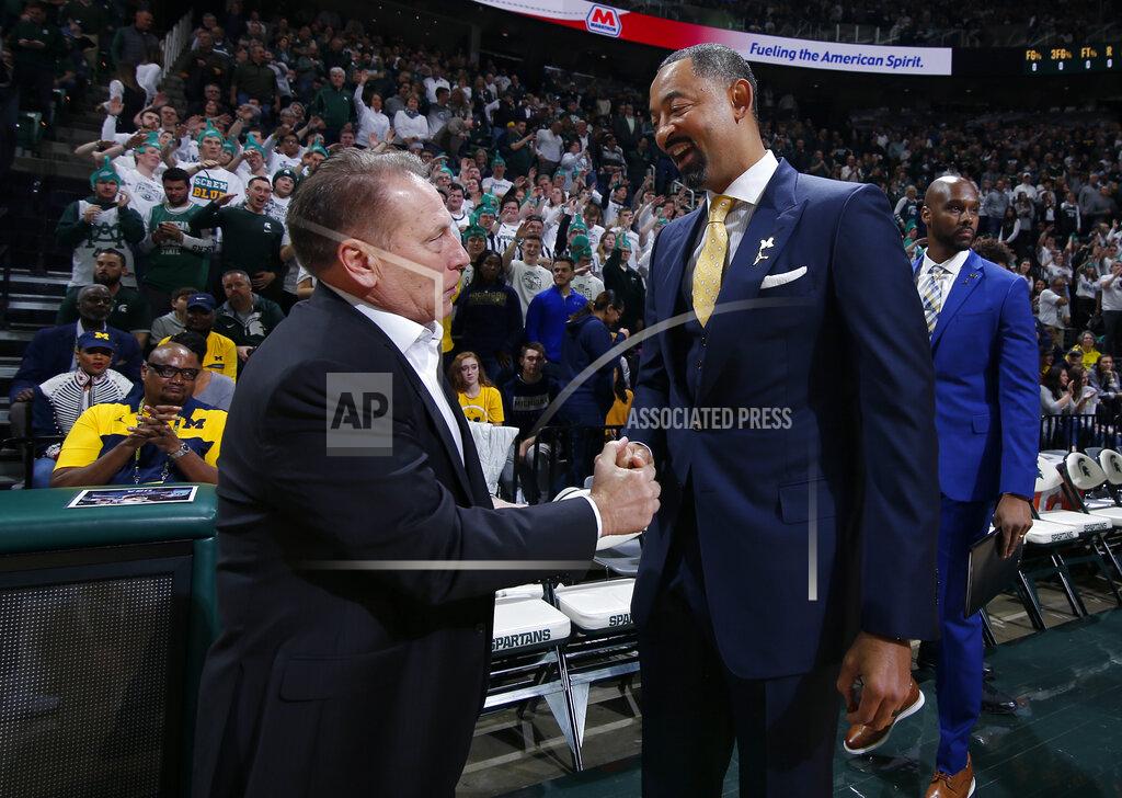 Al Goldis Michigan State coach Tom Izzo, left, and Michigan coach Juwan Howard greet each other before an NCAA college basketball game, Sunday, Jan. 5, 2020, in East Lansing, Mich. Michigan State won 87-69. (AP Photo/Al Goldis)