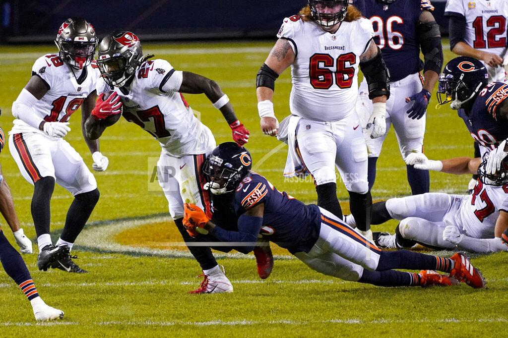 Charles Rex Arbogast Tampa Bay Buccaneers running back Ronald Jones (27) is tackled by Chicago Bears free safety Eddie Jackson (39) during the first half of an NFL football game in Chicago, Thursday, Oct. 8, 2020. (AP Photo/Charles Rex Arbogast)