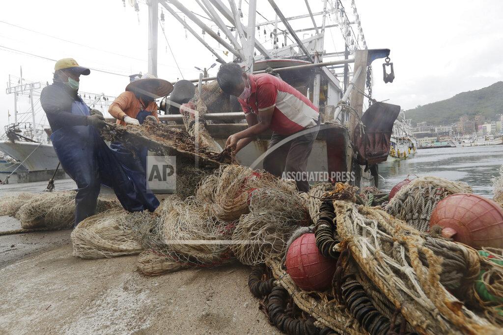 Chiang Ying-Ying Fishermen organize fishing nets to take shelter as Typhoon Chanthu approaches to Taiwan in Keelung, New Taipei City, Taiwan, Saturday, Sept. 11, 2021. Taiwan’s weather bureau warned of high winds and heavy rain as Typhoon Chanthu roared toward the island Saturday and said the storm’s center was likely to pass its east coast instead of hitting land. (AP Photo/Chiang Ying-ying)
