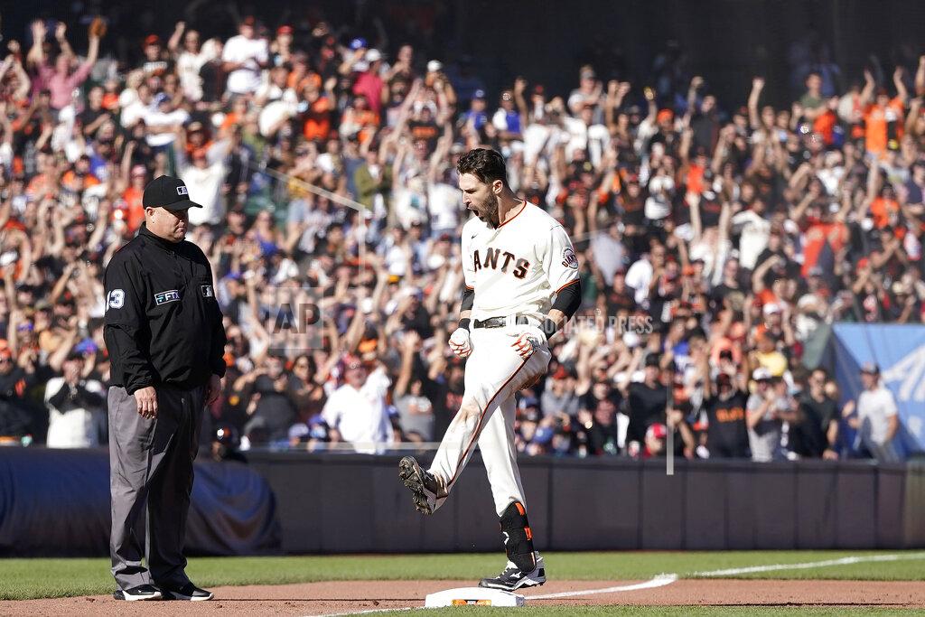 Jeff Chiu San Francisco Giants' Steven Duggar celebrates after hitting a two-run triple against the Los Angeles Dodgers during the second inning of a baseball game in San Francisco, Sunday, Sept. 5, 2021. (AP Photo/Jeff Chiu)