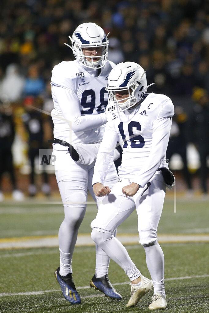 Brian Blanco Georgia Southern's Tyler Bass (16) celebrates his 49-yard field goal with Anthony Beck II (98) during the first half of the team's NCAA college football game against Appalachian State on Thursday, Oct. 31, 2019, in Boone, N.C. (AP Photo/Brian Blanco)