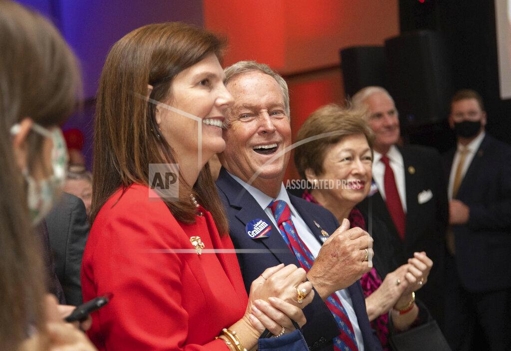 Tracy Glantz South Carolina Lt. Gov. Pamela Evette and Rep. Joe Wilson, R-S.C., applaud Sen. Lindsey Graham at an election-night gathering Tuesday, Nov. 3, 2020, in Columbia, S.C. (Tracy Glantz/The State via AP)
