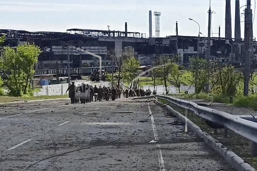 Uncredited FILE - In this photo taken from video released by the Russian Defense Ministry Press Service on Wednesday, May 18, 2022, Ukrainian servicemen leave the besieged Azovstal steel plant in Mariupol, Ukraine. Breaking its silence on prisoners of war, the Red Cross said Thursday, May 19, 2022 it has registered “hundreds” of Ukrainian prisoners of war who left the giant Azovstal steel plant in Mariupol after holding out in a weeks-long standoff with besieging Russian forces. (Russian Defense Ministry Press Service via AP, File)