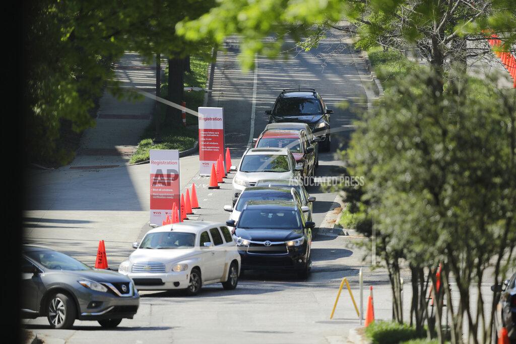 Brynn Anderson A line of cars gather to enter a COVID-19 testing site on Georgia Tech's campus, Monday, April 6, 2020, in Atlanta. (AP Photo/Brynn Anderson)