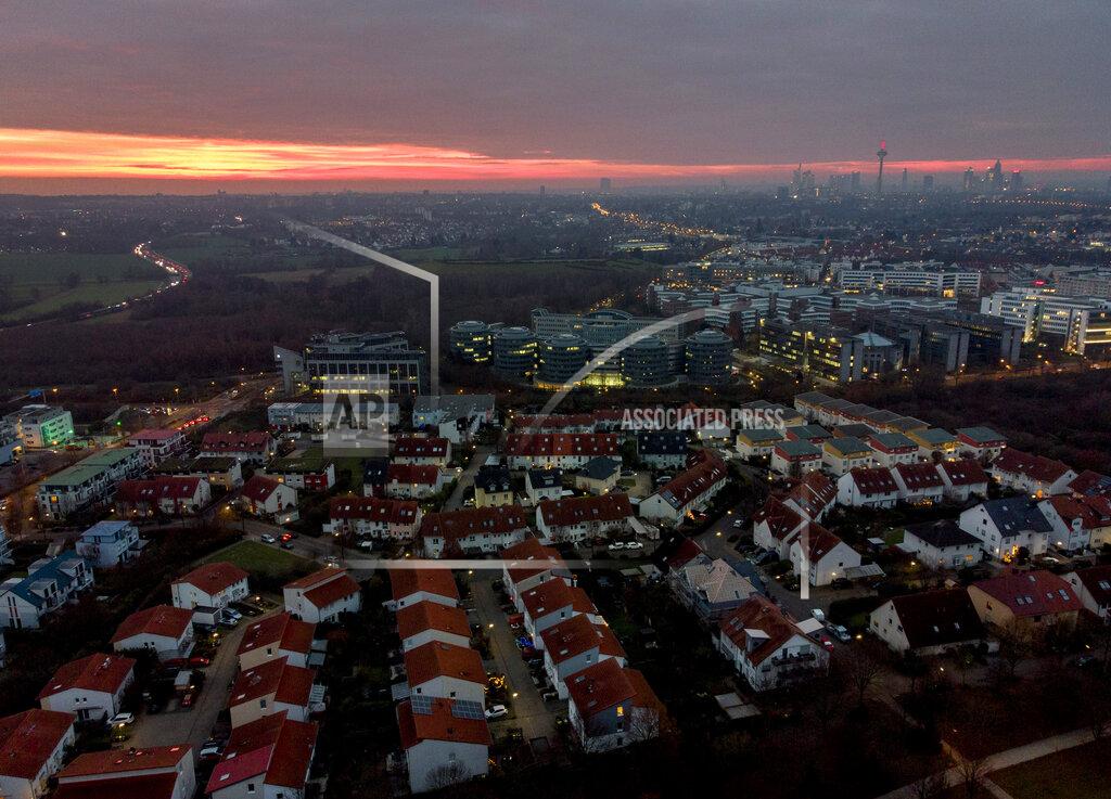Michael Probst Lights burn in houses in Frankfurt, Germany, Friday, Dec. 11, 2020, as the German government discusses further restrictions to avoid the outspread of the coronavirus. (AP Photo/Michael Probst)