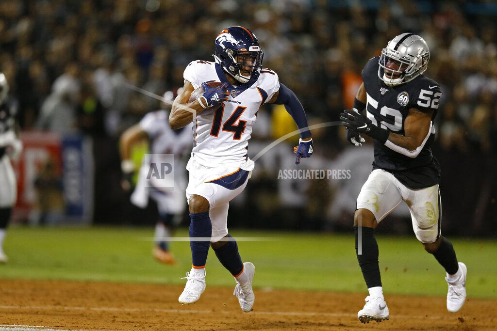 D. Ross Cameron Denver Broncos wide receiver Courtland Sutton runs with the ball past Oakland Raiders middle linebacker Marquel Lee (52) during the first half of an NFL football game Monday, Sept. 9, 2019, in Oakland, Calif. (AP Photo/D. Ross Cameron)