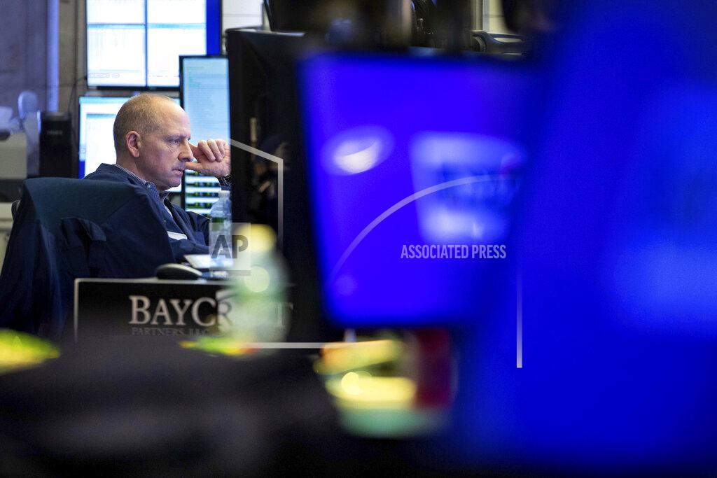 Allie Joseph In this photo provided by the New York Stock Exchange, trader Michael Urkonis works on the floor, Friday, May 20, 2022. Another drop for stocks on Friday has pushed the S&P 500 index 20% below its peak set early this year. (Allie Joseph/New York Stock Exchange via AP)