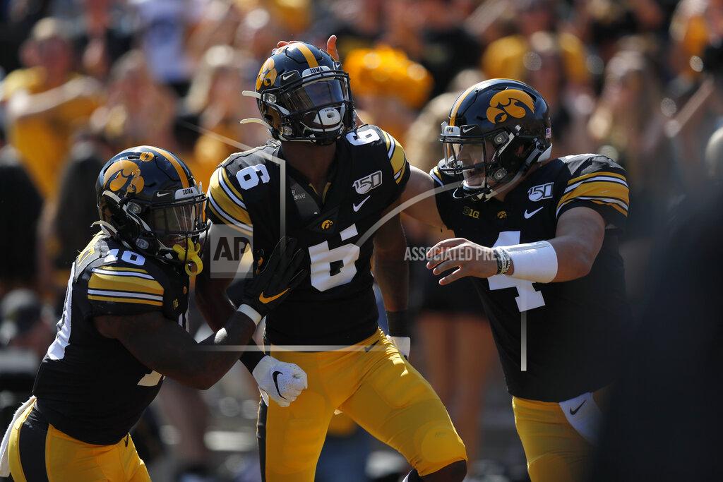 Matthew Putney Iowa running back Mekhi Sargent, left, and quarterback Nate Stanley, right, congratulate wide receiver Ihmir Smith-Marsette, center, after his touchdown during the first half of an NCAA college football game against Rutgers, Saturday, Sept. 7, 2019, in Iowa City. (AP Photo/Matthew Putney)