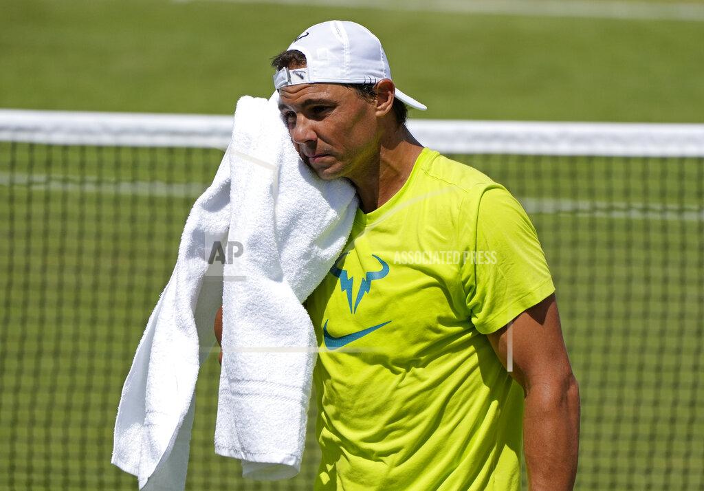 Alastair Grant Spain's Rafael Nadal wipes his face with a towel as he practices ahead of the Wimbledon tennis championships in London, Sunday, June 26, 2022. (AP Photo/Alastair Grant)
