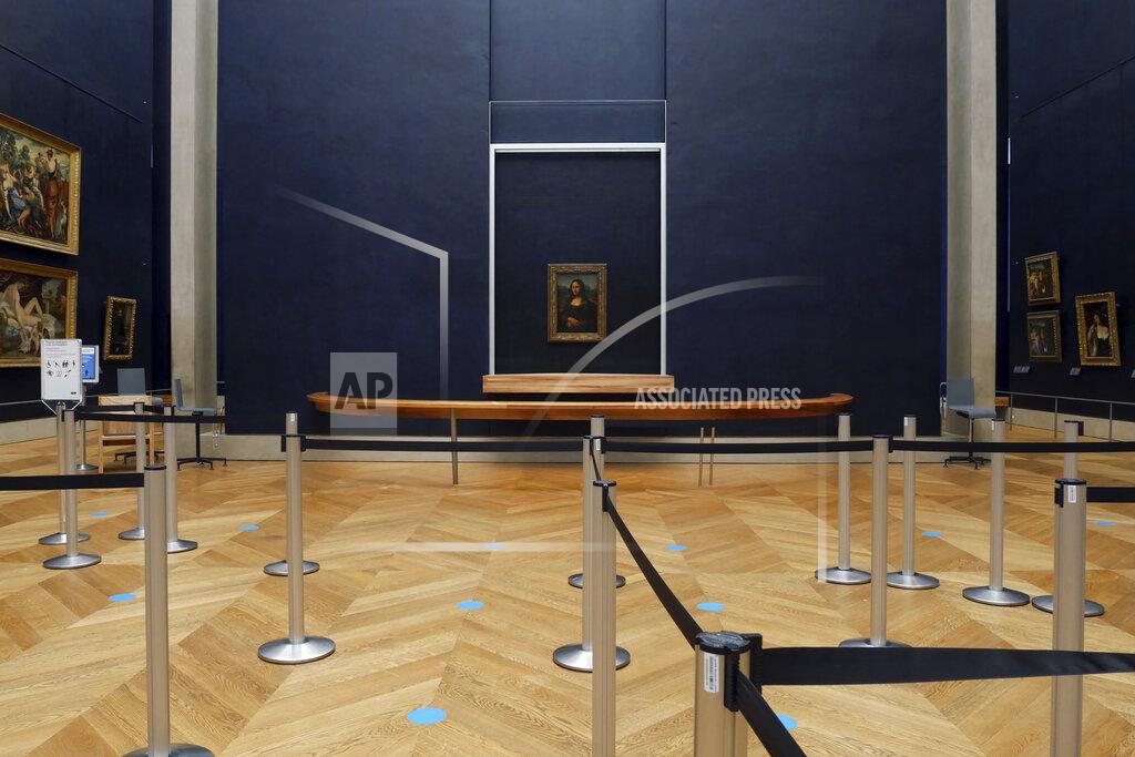 Thibault Camus Leonardo da Vinci's Mona Lisa hangs on the wall in a deserted Louvre museum, in Paris, Thursday, Feb. 11, 2021. The 518-year-old Mona Lisa will have seen many things in her life on display, but rarely this: Almost four months with no visitors. She stares out in Paris' Louvre, across bulletproof glass into the now-silent emptiness of the shuttered Salle des Etats. (AP Photo/Thibault Camus)