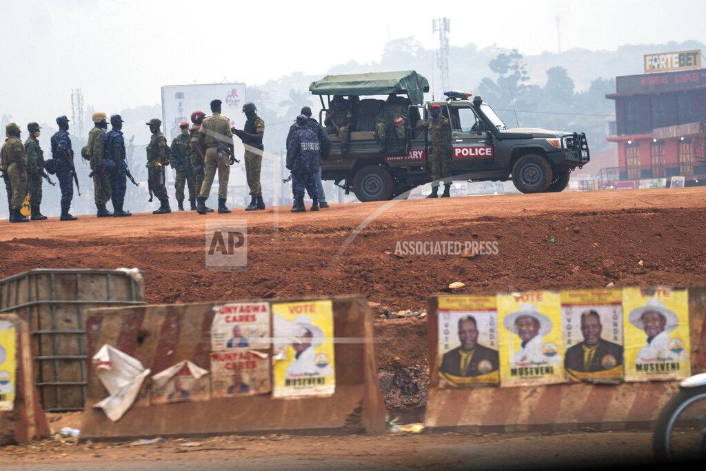 Jerome Delay Security forces gather in Kampala, Uganda, Thursday, Jan. 14, 2021. Ugandans are voting in a presidential election tainted by widespread violence that some fear could escalate as security forces try to stop supporters of leading opposition challenger BobiWine from monitoring polling stations.(AP Photo/Jerome Delay)