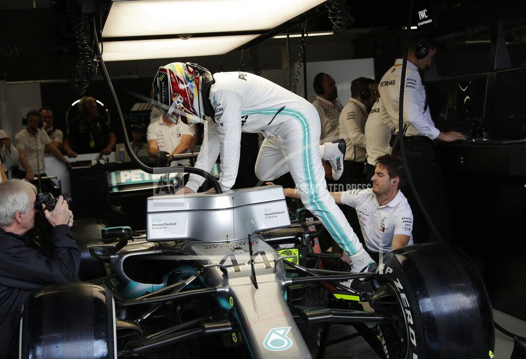 Silvia Izquierdo Mercedes' driver Lewis Hamilton, of Britain, climbs into his car during the first free practice at the Interlagos race track in Sao Paulo, Brazil, Friday, Nov. 15, 2019. Brazil Formula 1 GP will take place on Sunday. (AP Photo/Silvia Izquierdo)