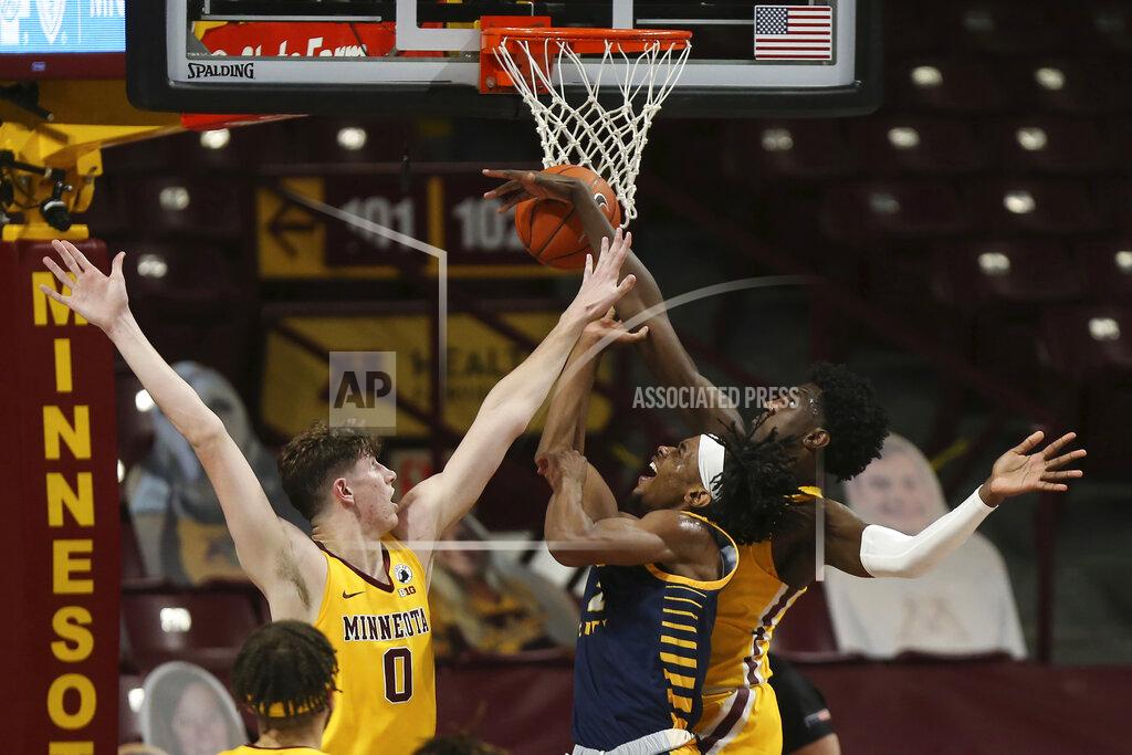 Stacy Bengs Minnesota forward Isaiah Ihnen, right, fouls UMKC guard Demarius Pitts (2) during the first half of an NCAA college basketball game Thursday, Dec. 10, 2020, in Minneapolis. (AP Photo/Stacy Bengs)