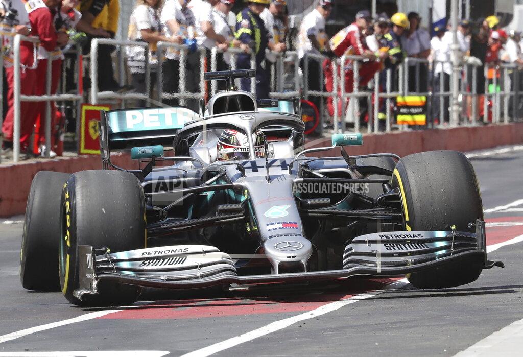 Tom Boland Mercedes driver Lewis Hamilton, of Britain, pulls into the pits with a broken rear tire after hitting the wall during the second practice session at the Formula One Canadian Grand Prix auto race, Friday, June 7, 2019, in Montreal. (Tom Boland/The Canadian Press via AP)